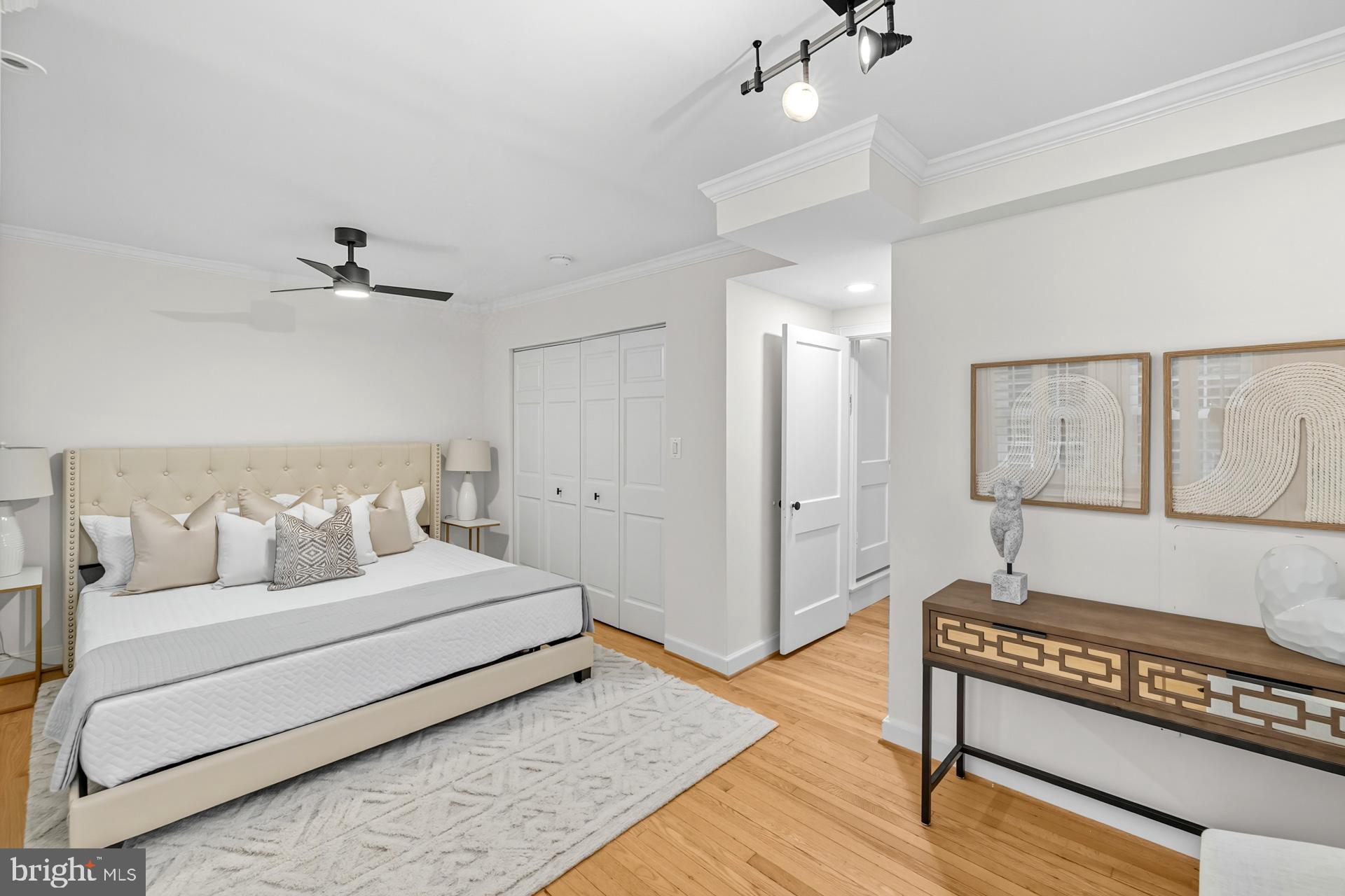 1628 44th Street Northwest Washington, DC 20007 - Photo 21 of 40 a spacious bedroom with a bed and a dresser
