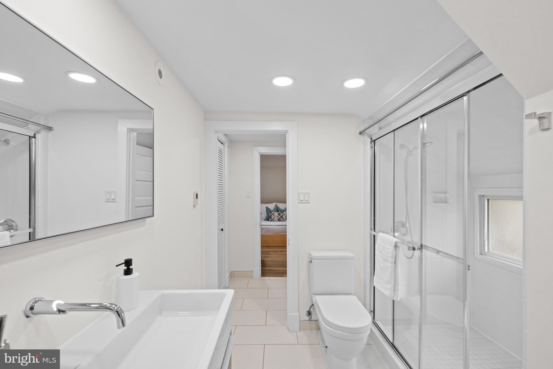 1628 44th Street Northwest Washington, DC 20007 - Photo 26 of 40 a bathroom with a sink a toilet and shower