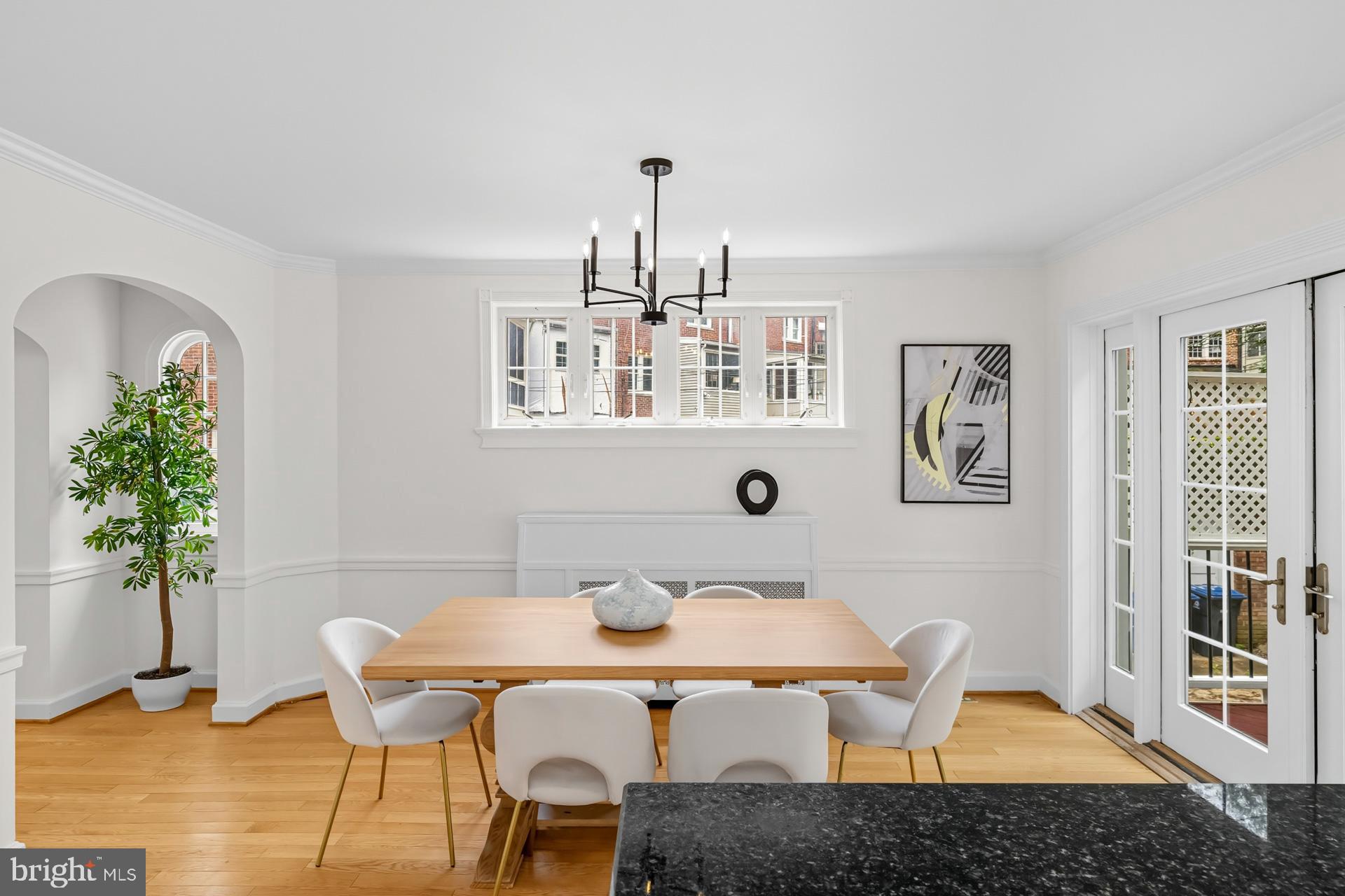 1628 44th Street Northwest Washington, DC 20007 - Photo 7 of 40 a view of a dining room with furniture and chandelier