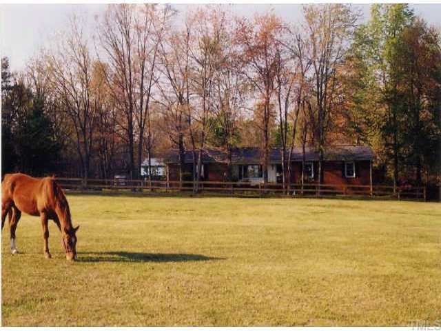 236 Hawkins Road Cedar Grove, NC 27231 - Photo 1 of 1 Front of home (taken from fenced pasture area earlier this spring).