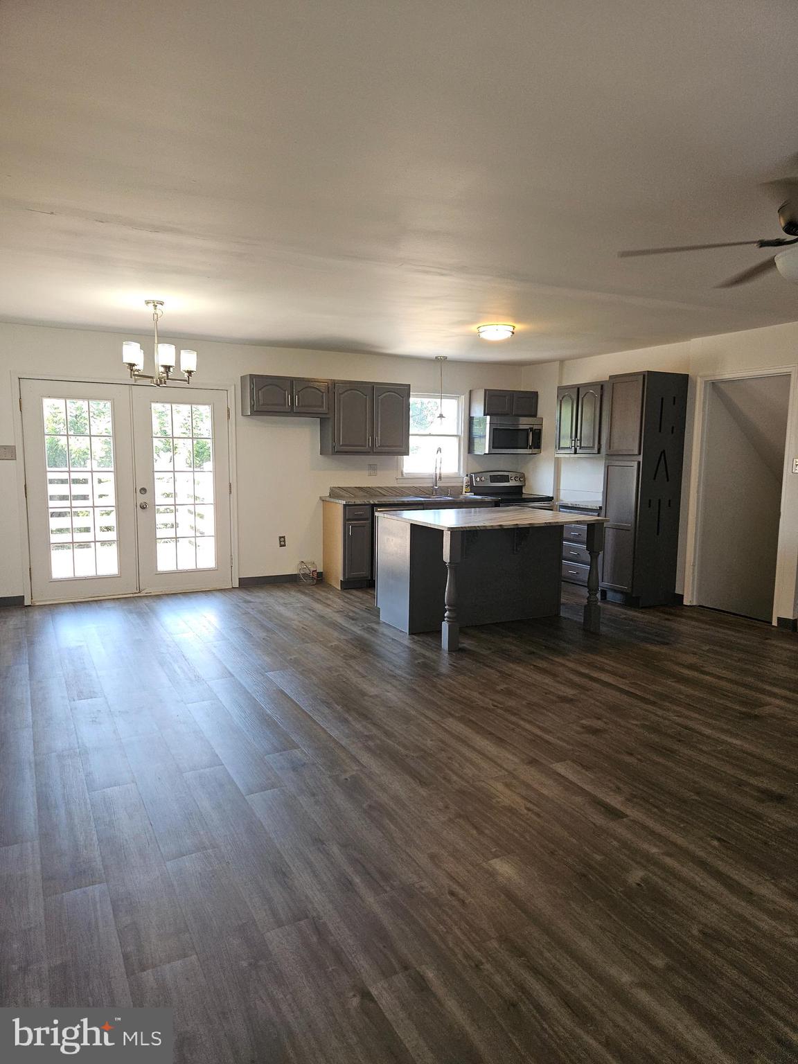 7860 Chambers Hill Road Harrisburg, PA 17111 - Photo 4 of 16 a view of a room with wooden floor and window