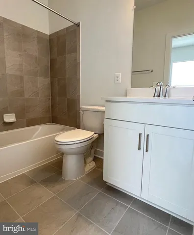 a bathroom with a toilet and a sink