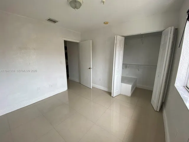 an empty room with a bathroom