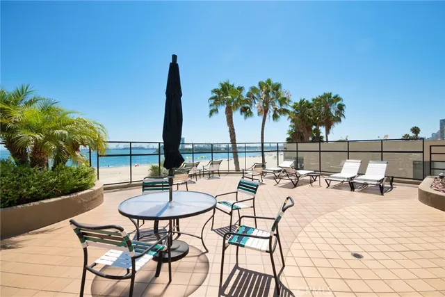 a view of swimming pool with outdoor seating and plants