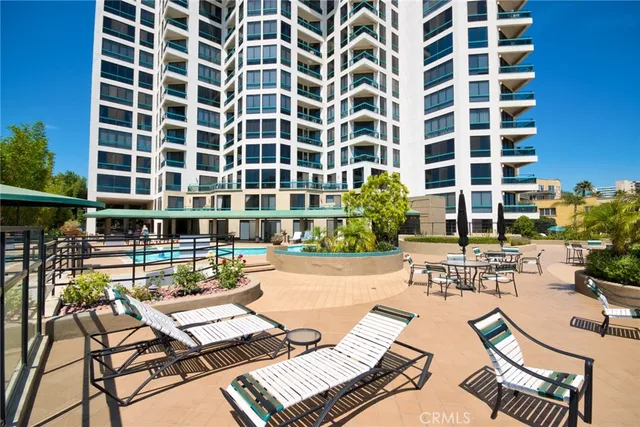a view of a swimming pool with outdoor seating