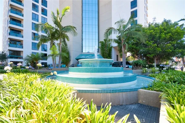 a view of swimming pool with outdoor seating and plants