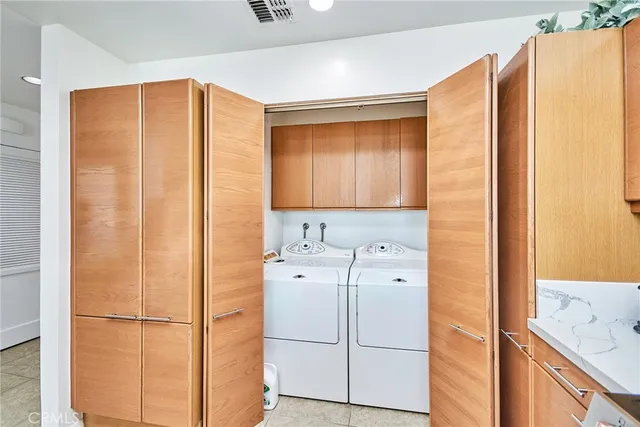 a kitchen with a refrigerator and cabinets