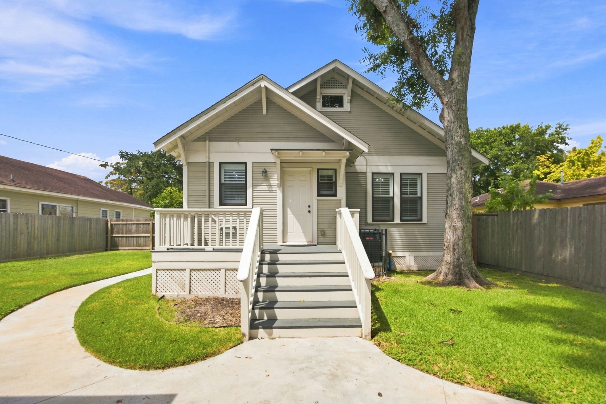 4618 McEwen Street Houston, TX 77009 - Photo 20 of 39 On the back of the home, enjoy this lovely patio as well as mature Oak Tree. Notice PLENTY of green space!
