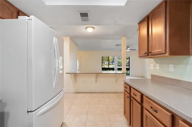 a view of a kitchen with microwave and cabinets