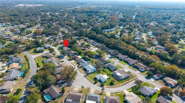 an aerial view of residential houses with outdoor space