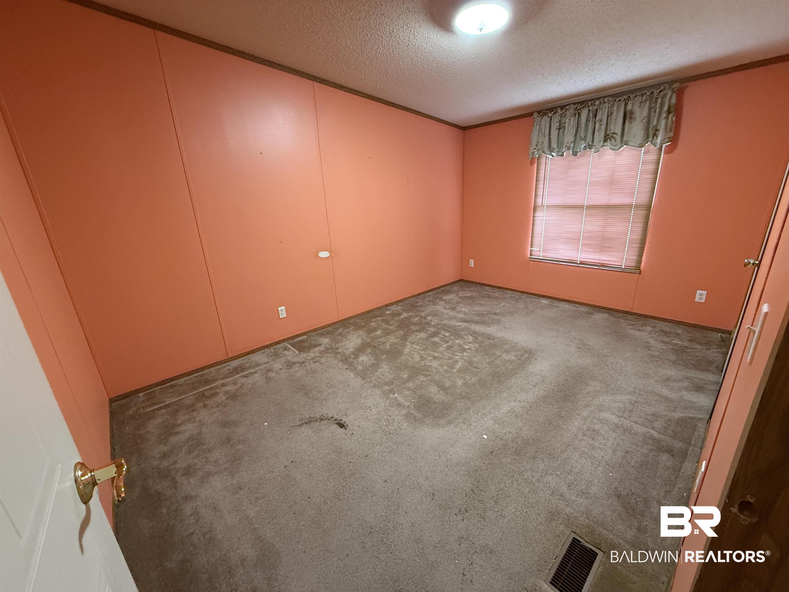 14402 County Road 55 Foley, AL 36535 - Photo 16 of 20 Unfurnished room with a textured ceiling and carpet floors