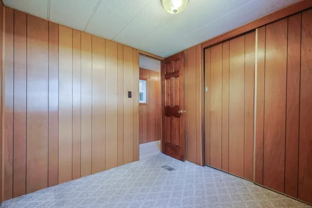 a view of a livingroom with furniture and a window