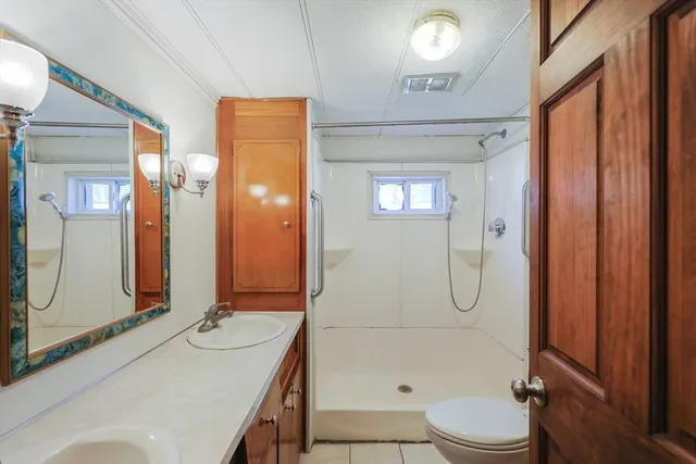 a view of a backyard with a large tree