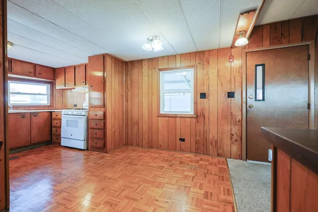 a view of a kitchen with a refrigerator cabinet cabinet and a kitchen