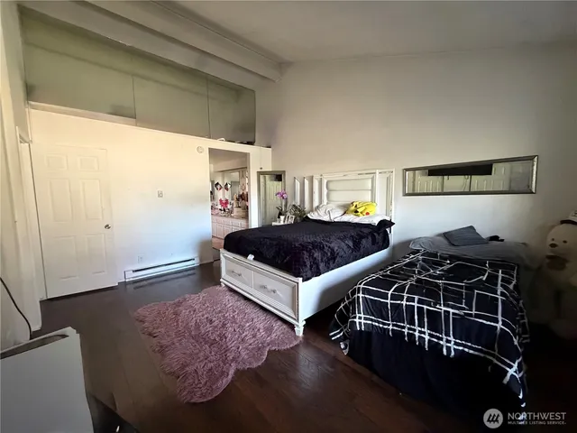 a bedroom with bed and window