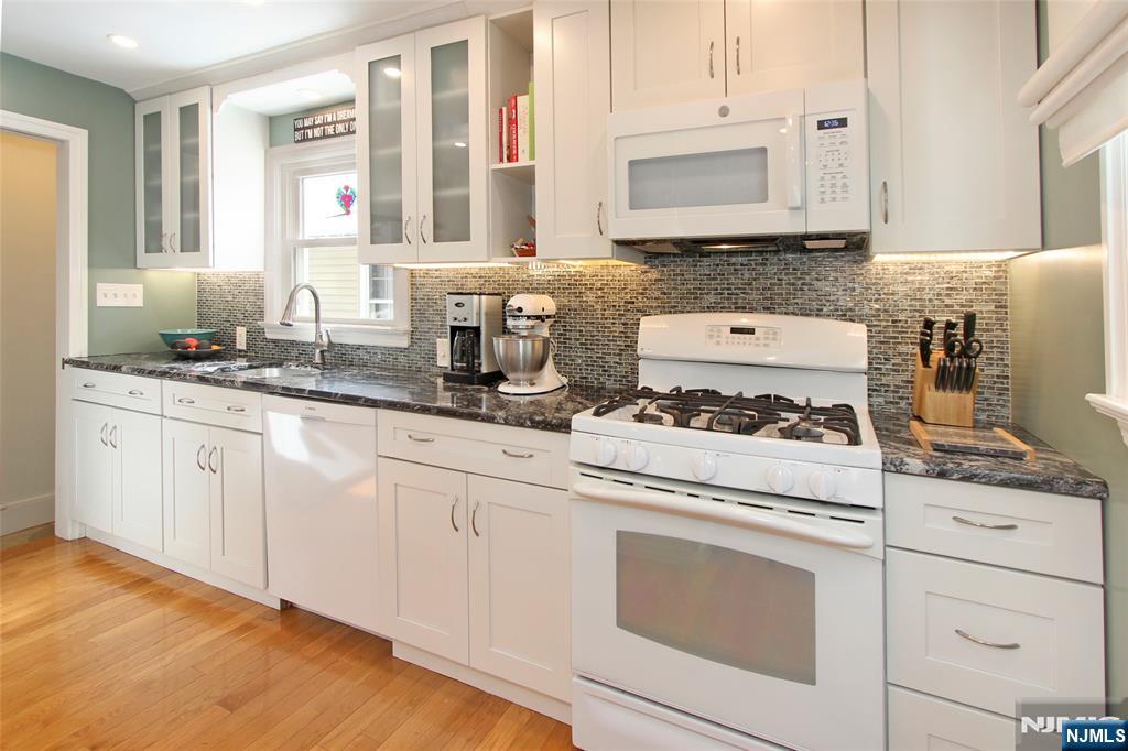 14 Davidson Road Bloomfield, NJ 07003 - Photo 14 of 50 a kitchen with granite countertop cabinets stainless steel appliances and a sink