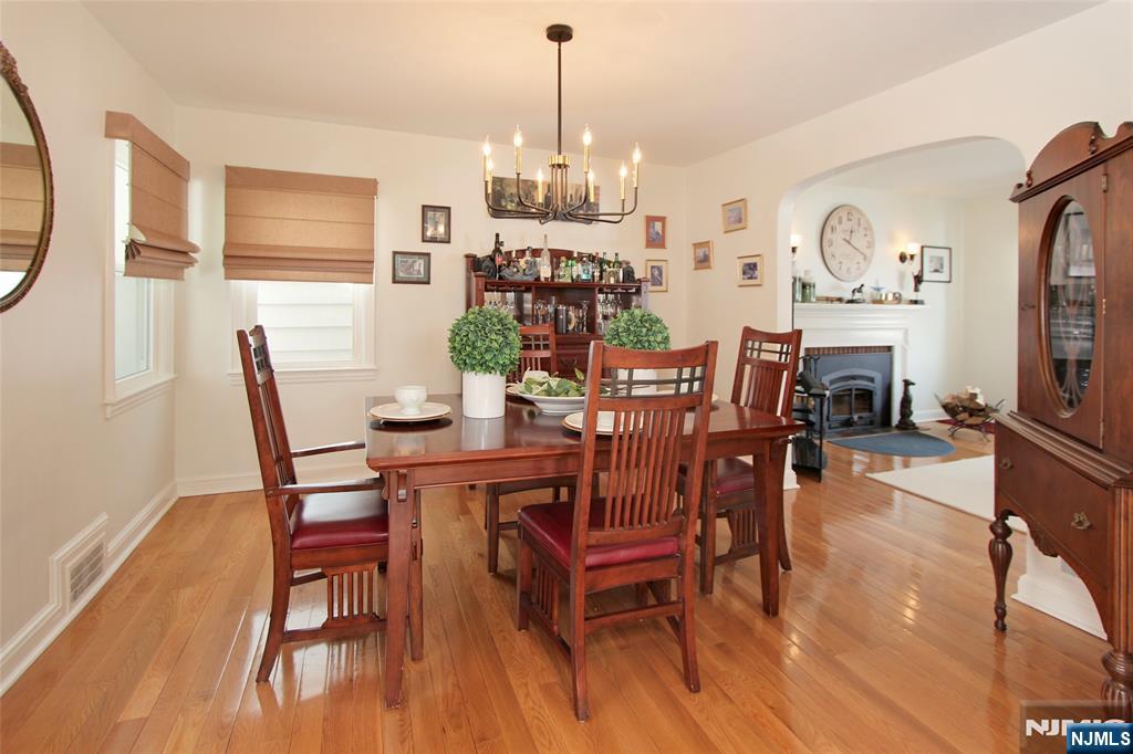 14 Davidson Road Bloomfield, NJ 07003 - Photo 19 of 50 a dining room with furniture a chandelier and wooden floor