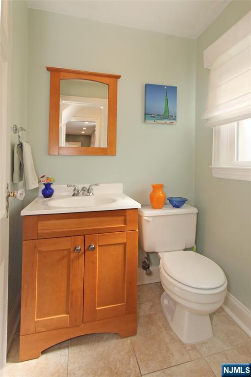 14 Davidson Road Bloomfield, NJ 07003 - Photo 28 of 50 a bathroom with a toilet sink and mirror