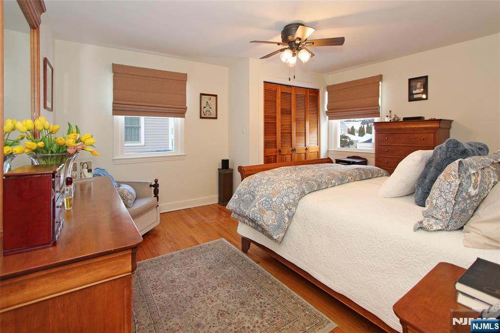 14 Davidson Road Bloomfield, NJ 07003 - Photo 29 of 50 a bedroom with a bed and a chandelier