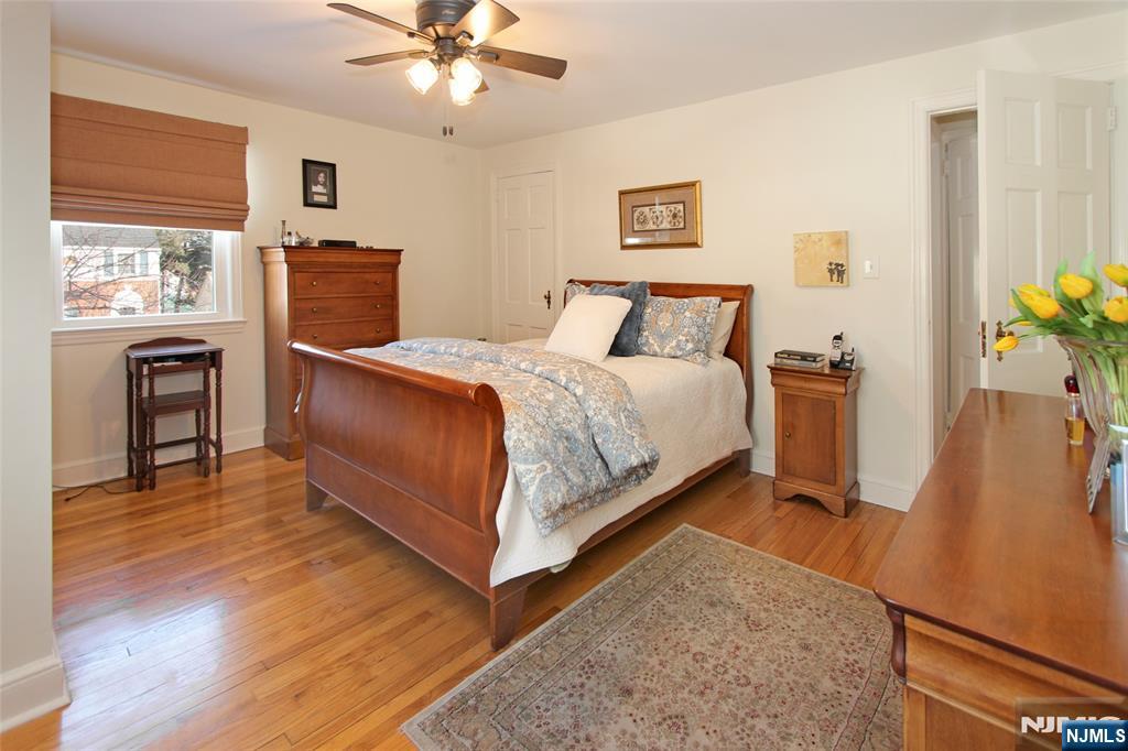 14 Davidson Road Bloomfield, NJ 07003 - Photo 30 of 50 a bedroom with a bed and wooden floor