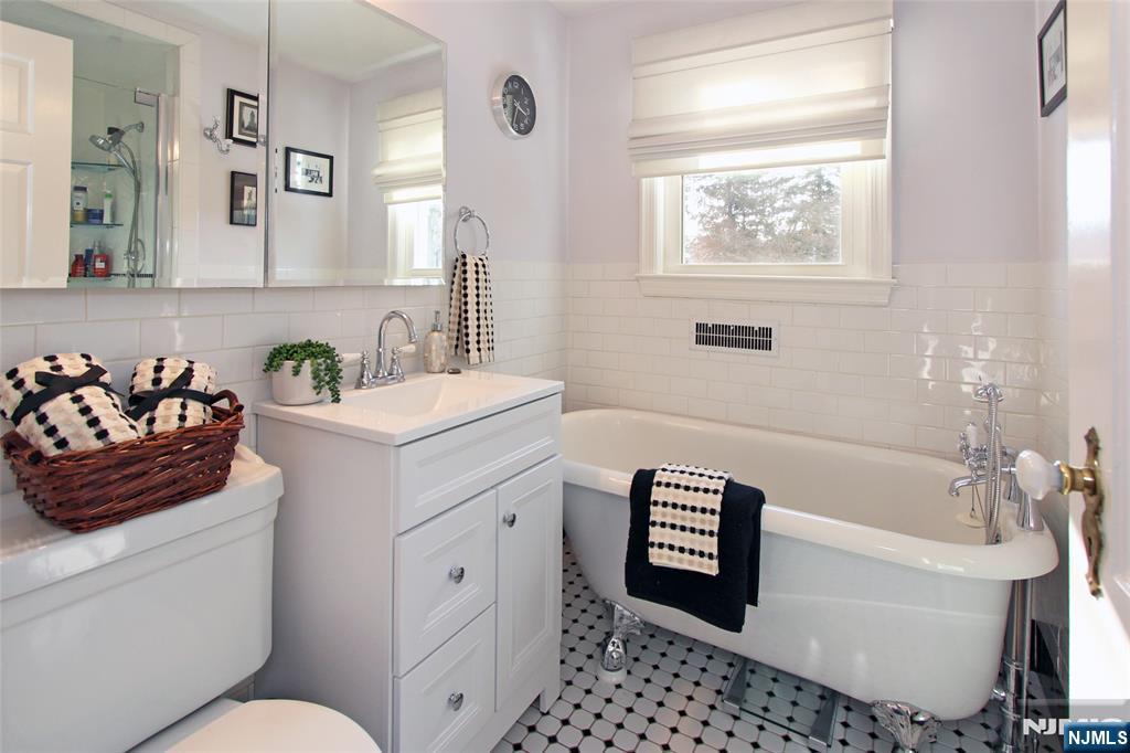 14 Davidson Road Bloomfield, NJ 07003 - Photo 35 of 50 a bathroom with a sink a toilet and a bathtub