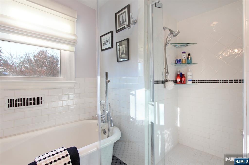 14 Davidson Road Bloomfield, NJ 07003 - Photo 36 of 50 a bathroom with a bathtub and a shower