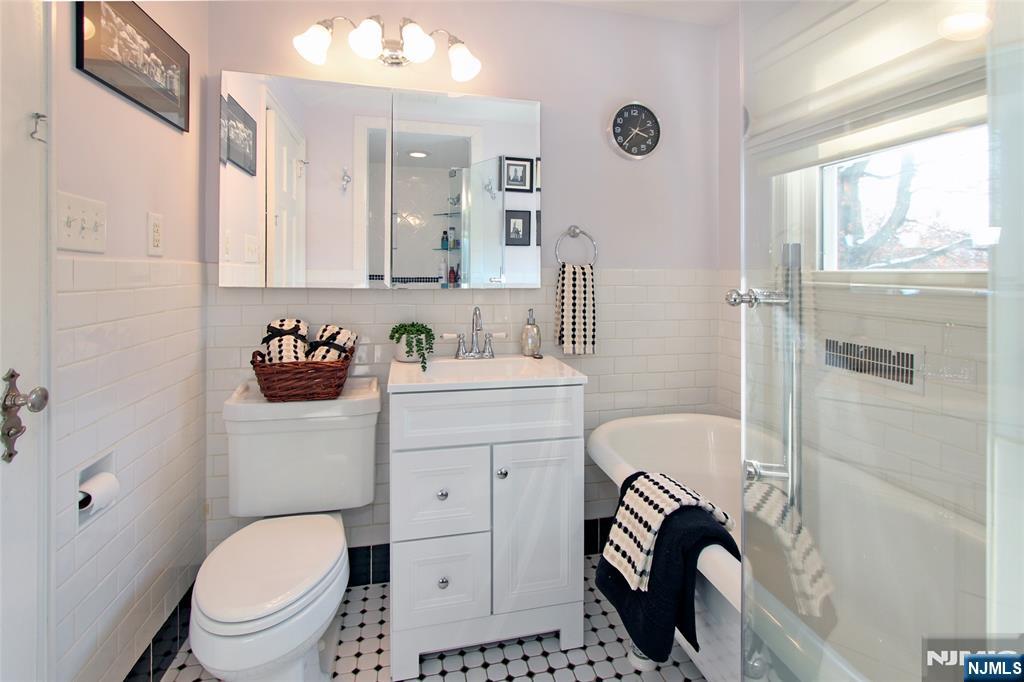 14 Davidson Road Bloomfield, NJ 07003 - Photo 37 of 50 a bathroom with a sink toilet and shower