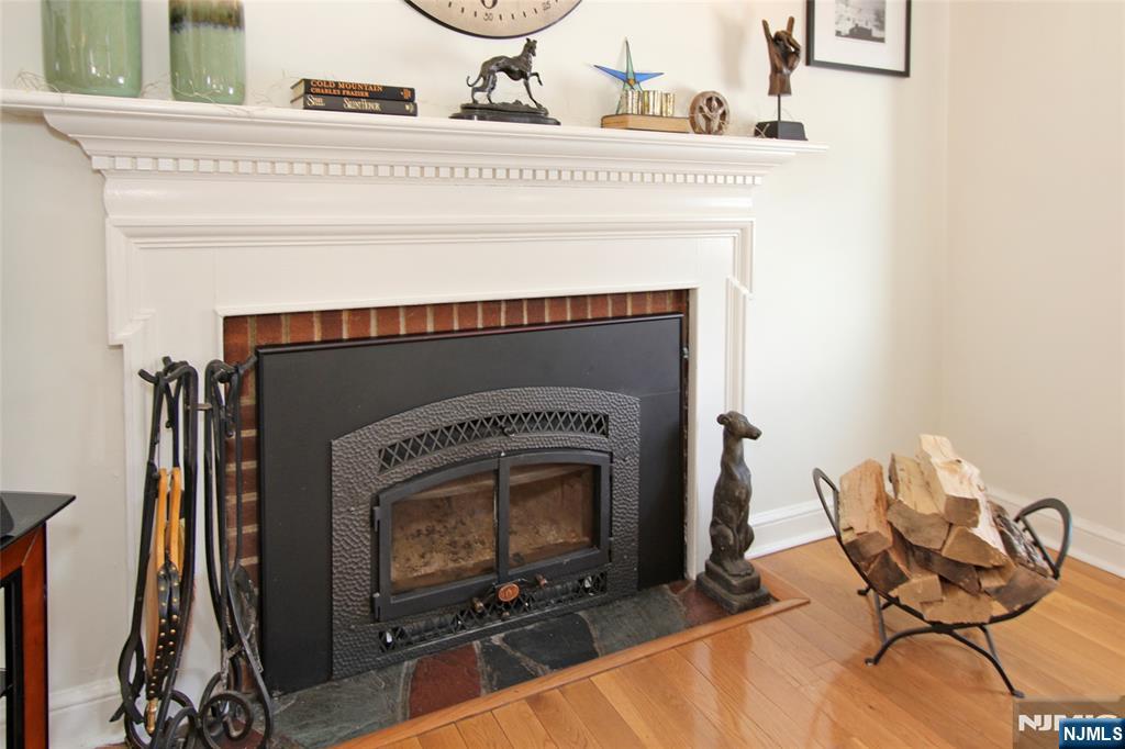 14 Davidson Road Bloomfield, NJ 07003 - Photo 8 of 50 a living room with furniture and a fireplace