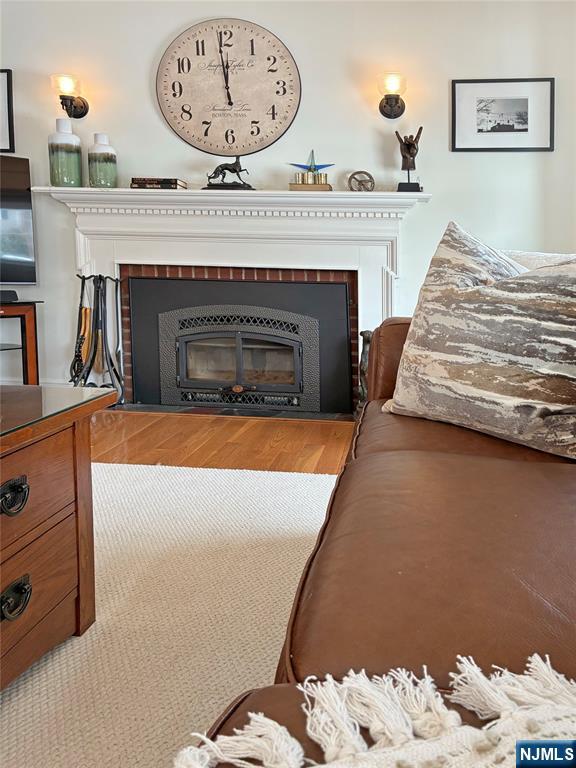 14 Davidson Road Bloomfield, NJ 07003 - Photo 10 of 50 a living room with furniture and a fireplace