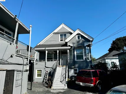 a view of house with a chairs in patio