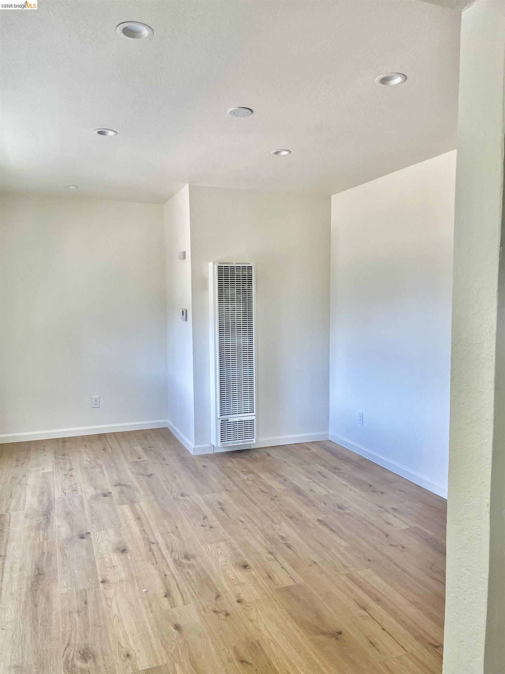 1507 Prince Street Berkeley, CA 94703 - Photo 20 of 30 a view of empty room with wooden floor