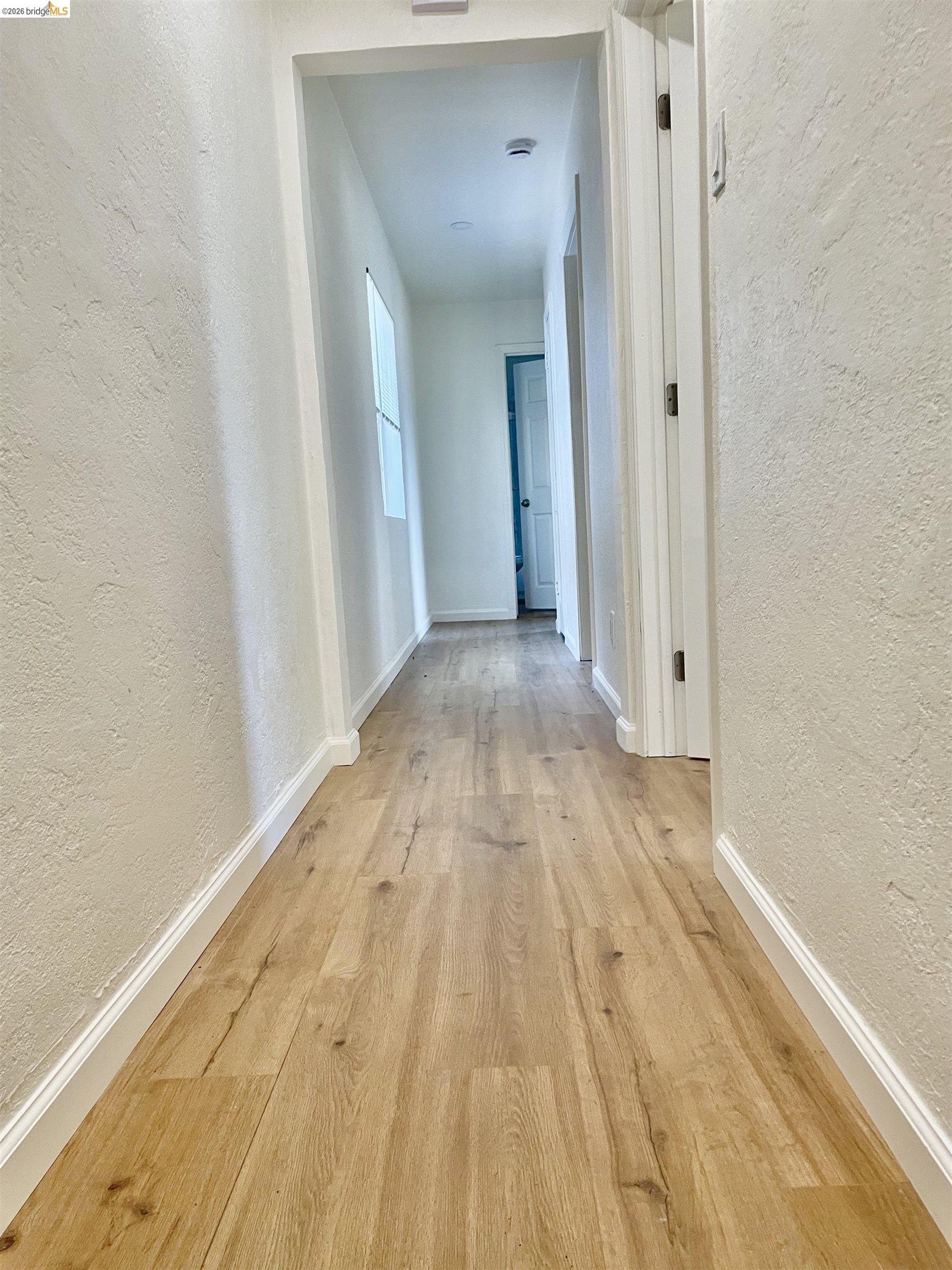 1507 Prince Street Berkeley, CA 94703 - Photo 21 of 30 a view of a hallway with wooden floor