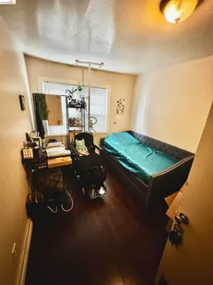 a dining room with furniture and a floor to ceiling window
