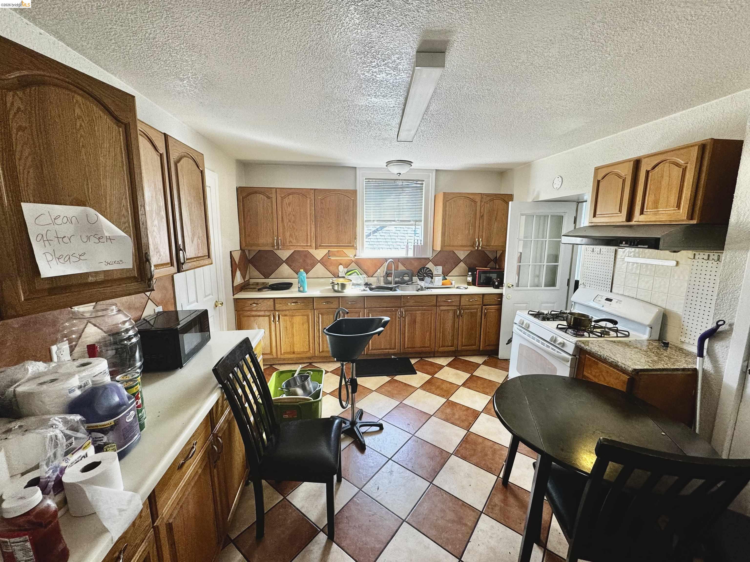 1507 Prince Street Berkeley, CA 94703 - Photo 27 of 30 a dining room with furniture and a floor to ceiling window