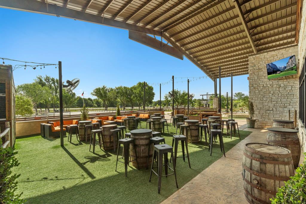 148 Hudson Lane Justin, TX 76247 - Photo 19 of 21 a view of chairs and tables in patio