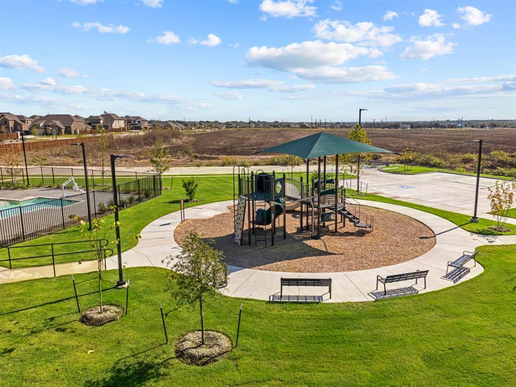 148 Hudson Lane Justin, TX 76247 - Photo 9 of 21 a view of a swimming pool with lawn chairs
