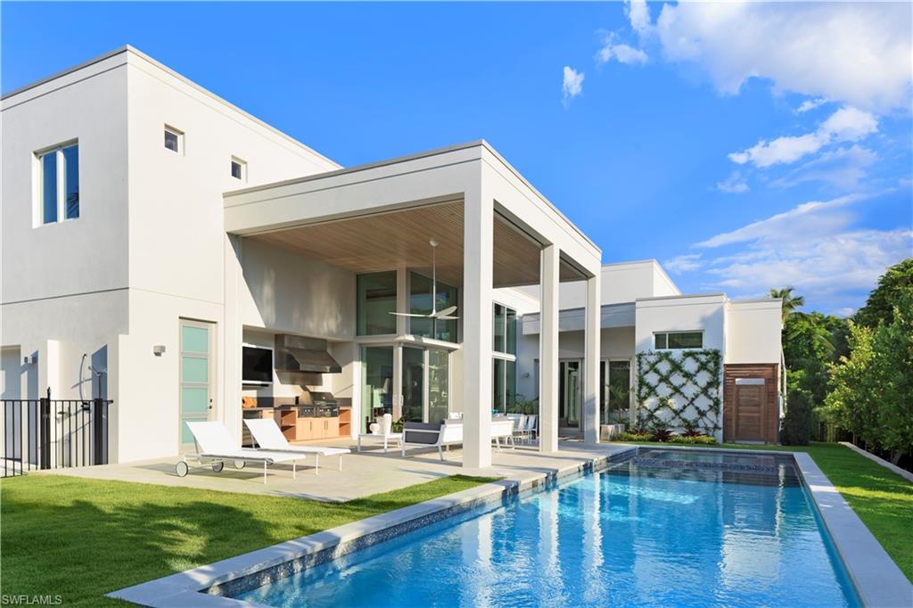 387 Bow Line Drive Naples, FL 34103 - Photo 17 of 18 a view of a house with backyard porch and sitting area