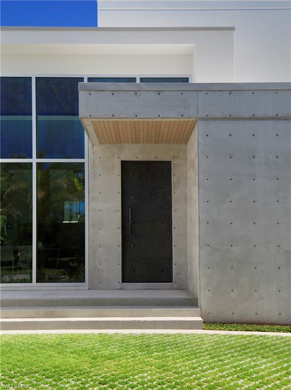 387 Bow Line Drive Naples, FL 34103 - Photo 5 of 18 a view of a livingroom with a fireplace