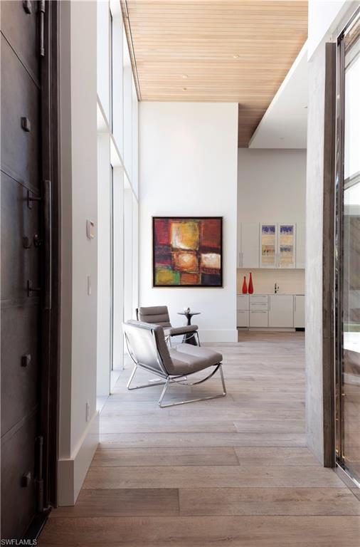 387 Bow Line Drive Naples, FL 34103 - Photo 6 of 18 a living room with furniture and a flat screen tv