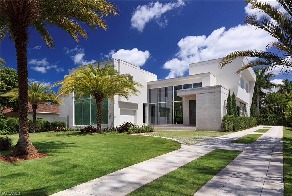 387 Bow Line Drive Naples, FL 34103 - Photo 7 of 18 a front view of a house with garden