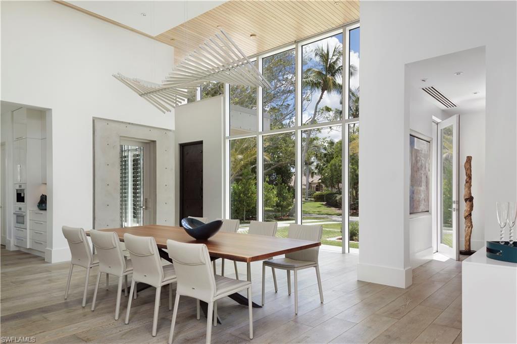 387 Bow Line Drive Naples, FL 34103 - Photo 8 of 18 a view of a dining room with furniture window and outside view