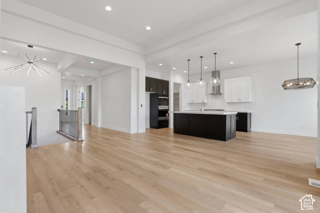 538 North Legend Circle, Unit 505 Mapleton, UT 84664 - Photo 19 of 48 Open-concept living space featuring light wood-finish flooring, recessed lighting, and a modern kitchen