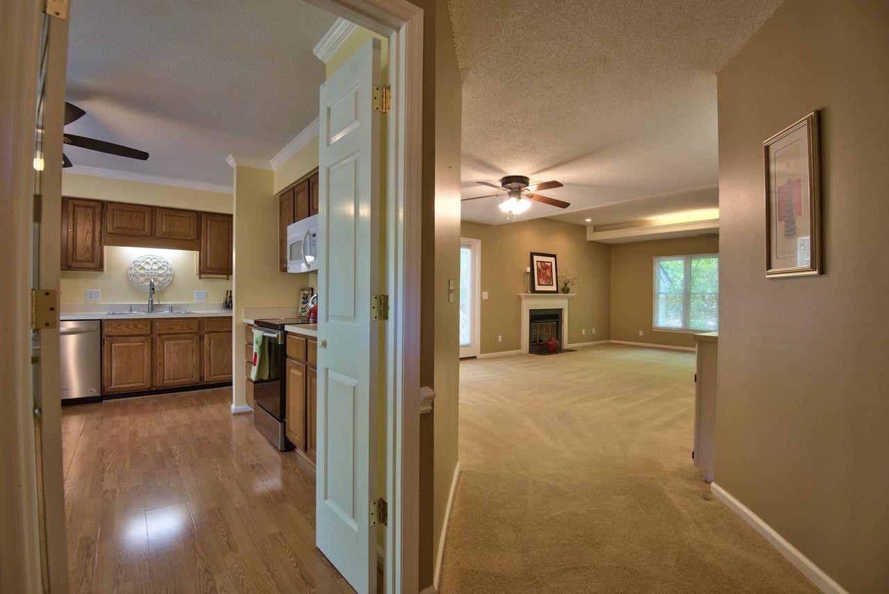3219 Coachman's Way Durham, NC 27705 - Photo 15 of 33 a view of a kitchen cabinets and a livingroom