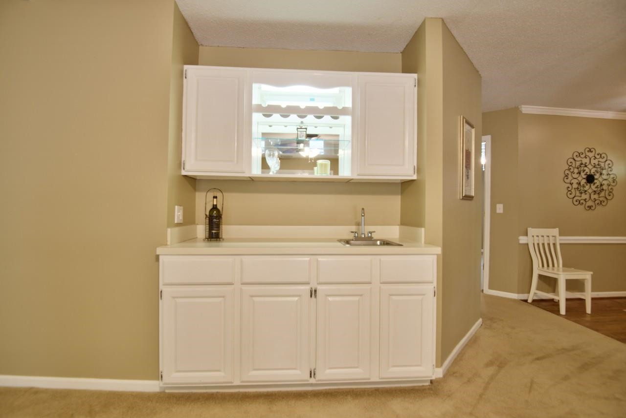 3219 Coachman's Way Durham, NC 27705 - Photo 19 of 33 a bathroom with a sink and a mirror