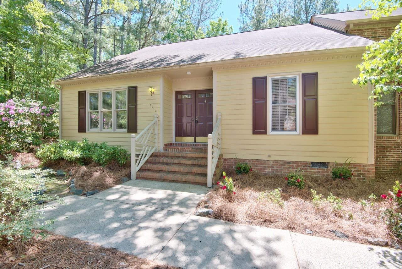 3219 Coachman's Way Durham, NC 27705 - Photo 2 of 33 a front view of a house with a yard