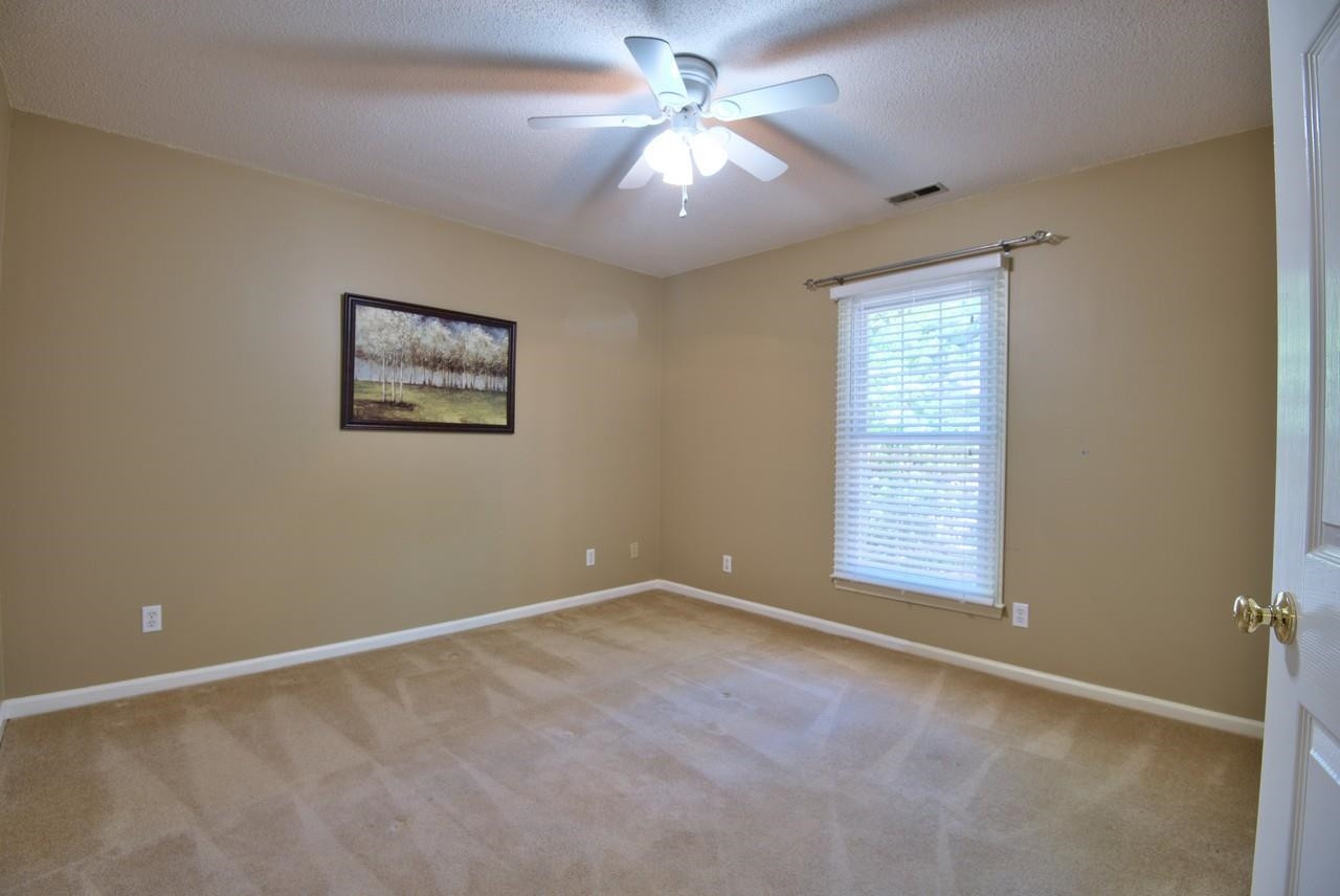 3219 Coachman's Way Durham, NC 27705 - Photo 22 of 33 an empty room with windows and fan