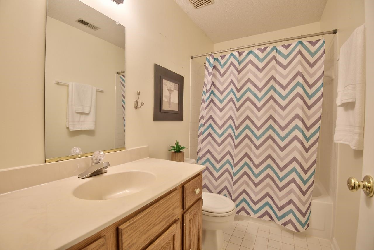 3219 Coachman's Way Durham, NC 27705 - Photo 26 of 33 a bathroom with a sink and a mirror