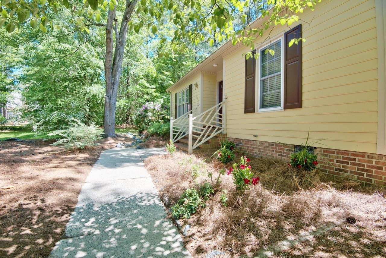 3219 Coachman's Way Durham, NC 27705 - Photo 33 of 33 a backyard of a house with lots of green space