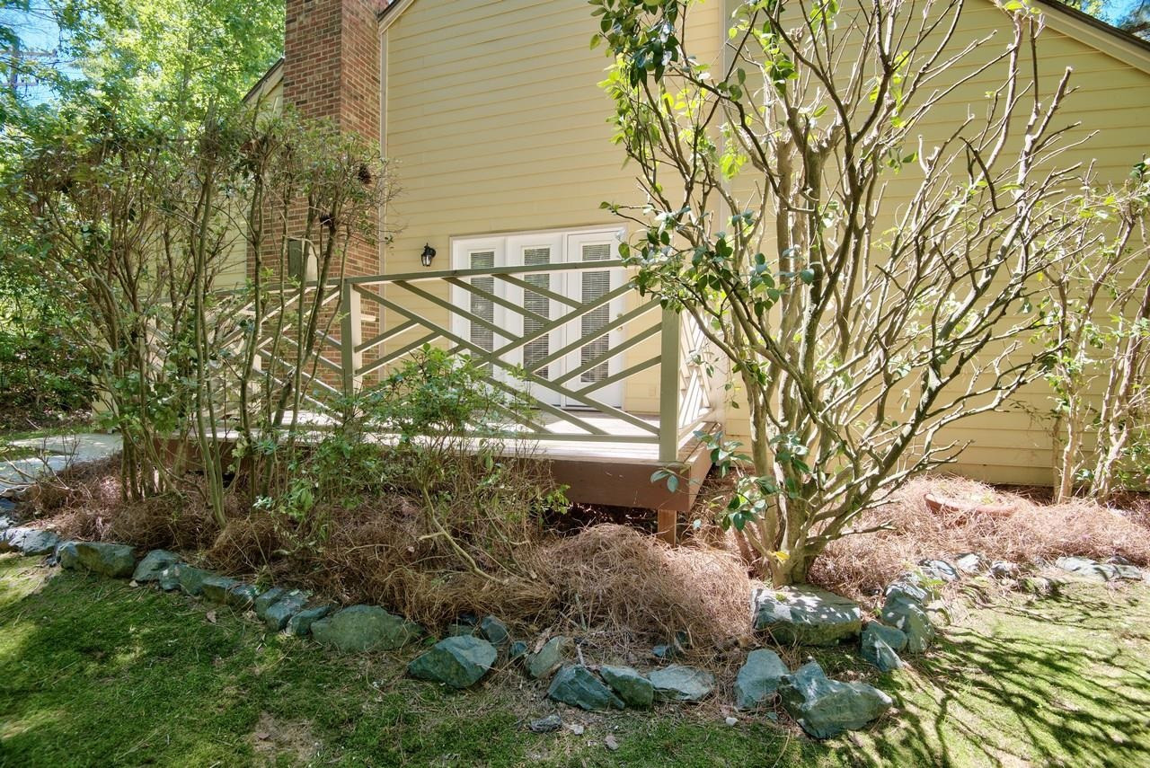 3219 Coachman's Way Durham, NC 27705 - Photo 5 of 33 a backyard of a building with trees