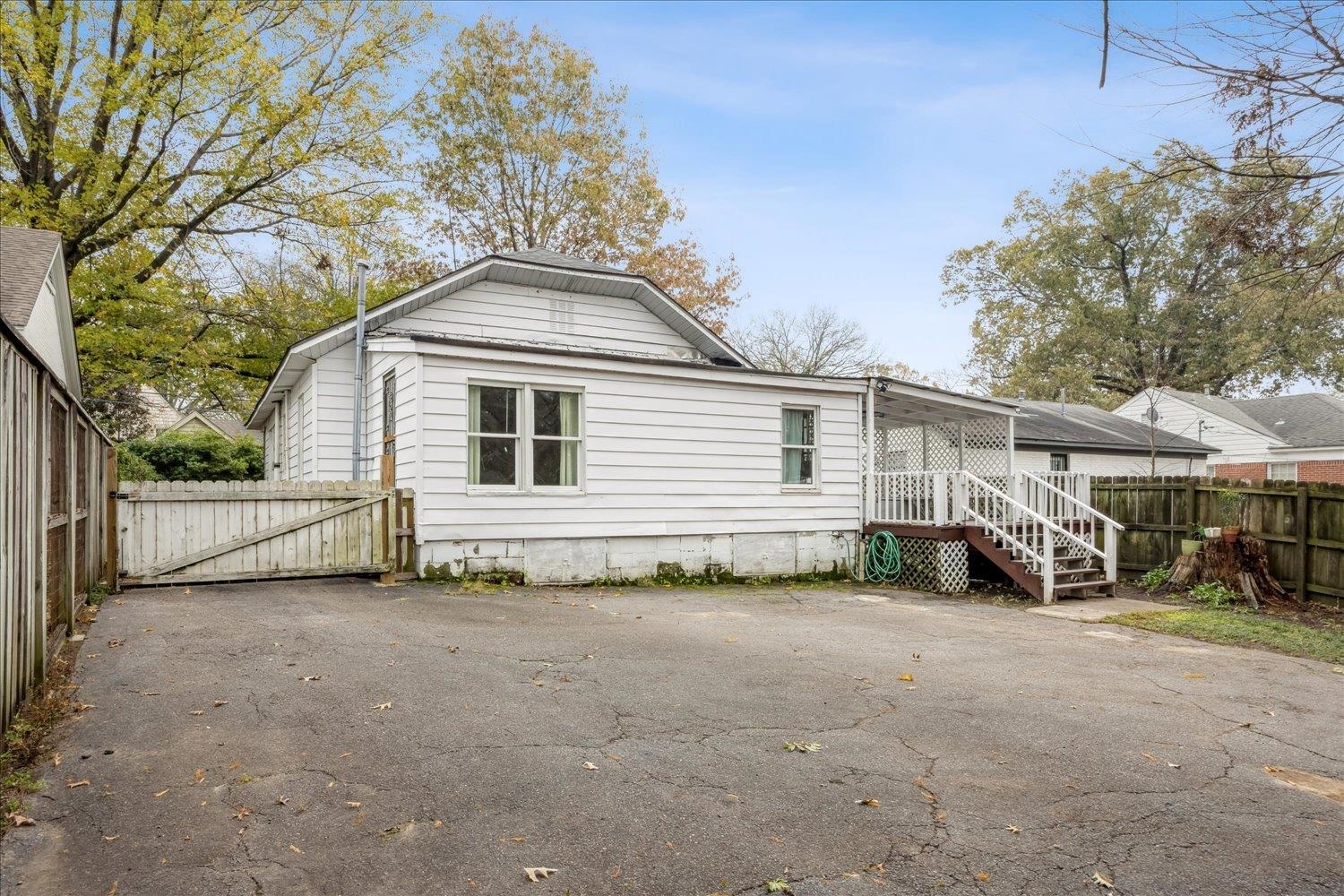 133 South Fenwick Road Memphis, TN 38111 - Photo 18 of 21 a view of a house with large trees and wooden fence